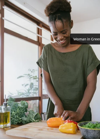 Young woman preparing vegetables in the kitchen